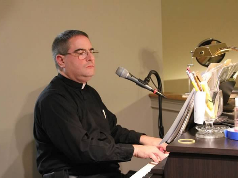 Father Bob leads Liturgical Music Practice